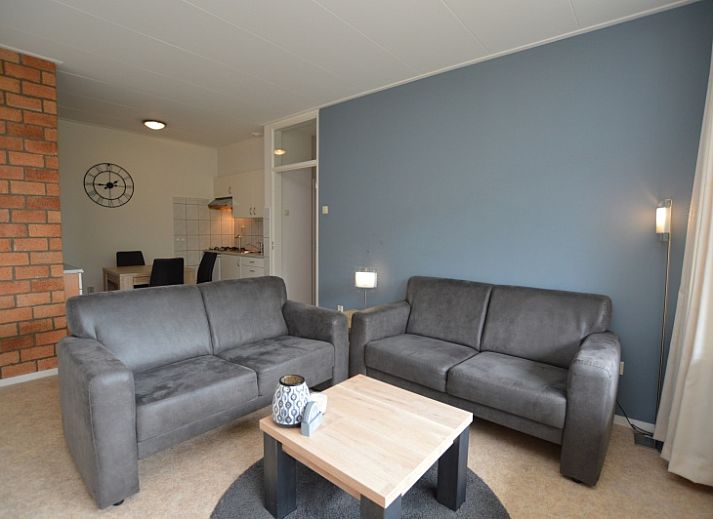 Cozy living room in Apartment Kerckeland 122, De Koog, Texel overlooking greenery.