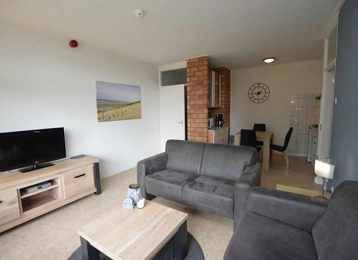 Bright living space of Apartment Kerckeland 122 in De Koog, Texel with comfortable seating.