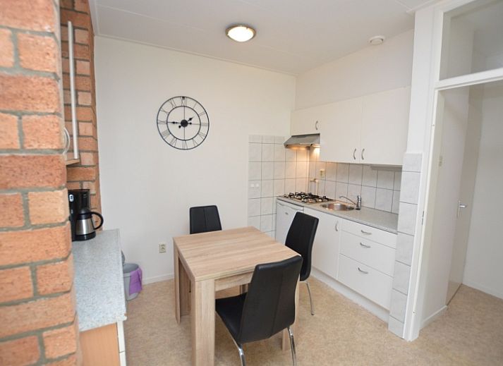 Bright living space of Apartment Kerckeland 122 in De Koog, Texel with comfortable seating.