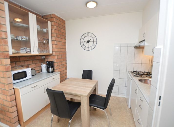 Bright living space of Apartment Kerckeland 122 in De Koog, Texel with comfortable seating.