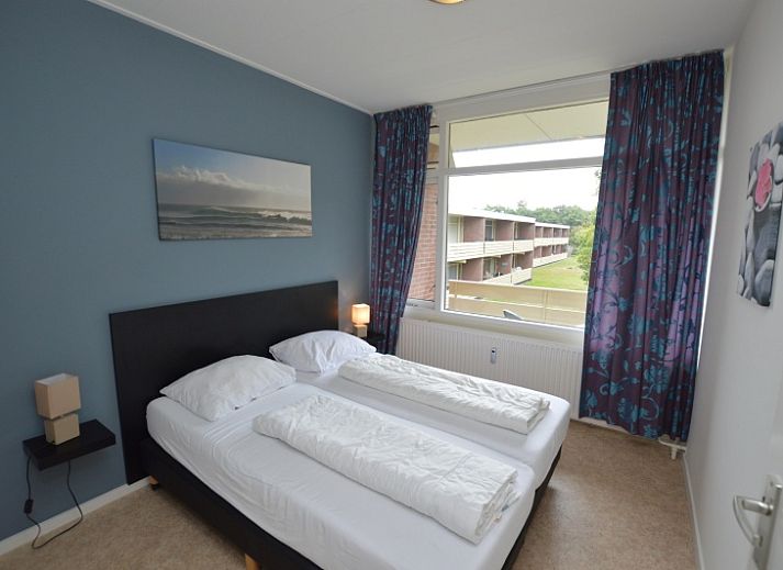 Bright living space of Apartment Kerckeland 122 in De Koog, Texel with comfortable seating.