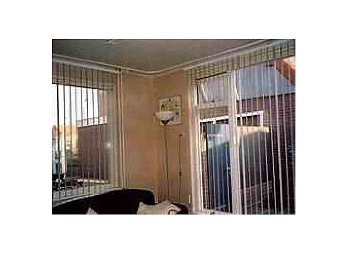 Brink 9b Bungalow in De Koog, Texel mit charmanter Backsteinfassade und ruhiger Umgebung auf den Watteninseln.