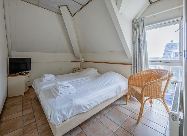 Gemuetliches Wohnzimmer des Resort De Buteriggel - Apartment 0 in De Koog, Texel mit komfortabler Sitzecke.