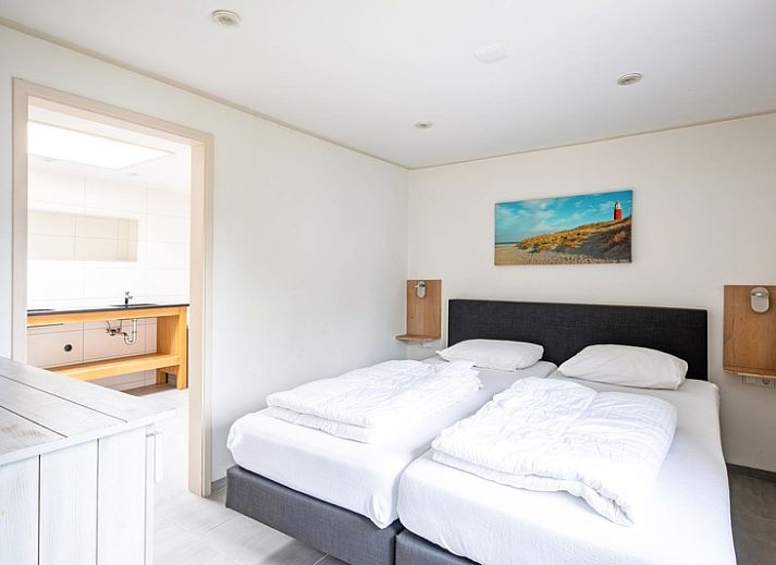 Cozy living room with fireplace in Orchismient 55 vacation home De Koog Texel.