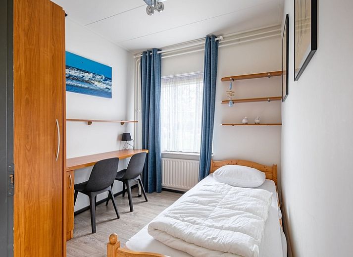 Cozy living room with fireplace in Orchismient 55 vacation home De Koog Texel.