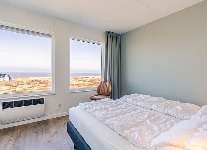Gemuetliche Sitzecke im Appartement Juliana 150 Zeezicht, De Koog Texel, mit Blick auf das Wattenmeer.