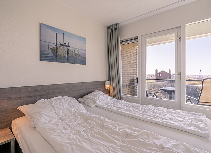 Gemuetliche Sitzecke im Appartement Juliana 150 Zeezicht, De Koog Texel, mit Blick auf das Wattenmeer.