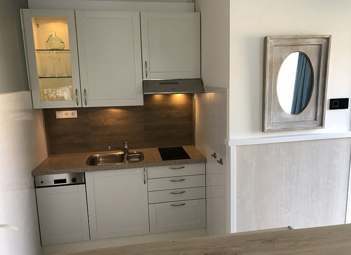 Attractive bedroom in Apartment Duinzee Texel, De Koog, with comfortable double bed and cozy sitting area.