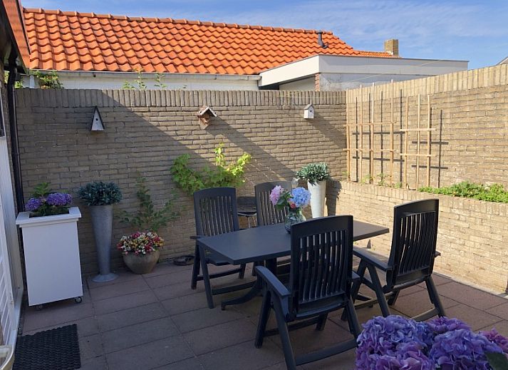 Spacious terrace at Apartment Duinzee Texel, De Koog, ideal for relaxing outside in the sun on the Wadden Islands.