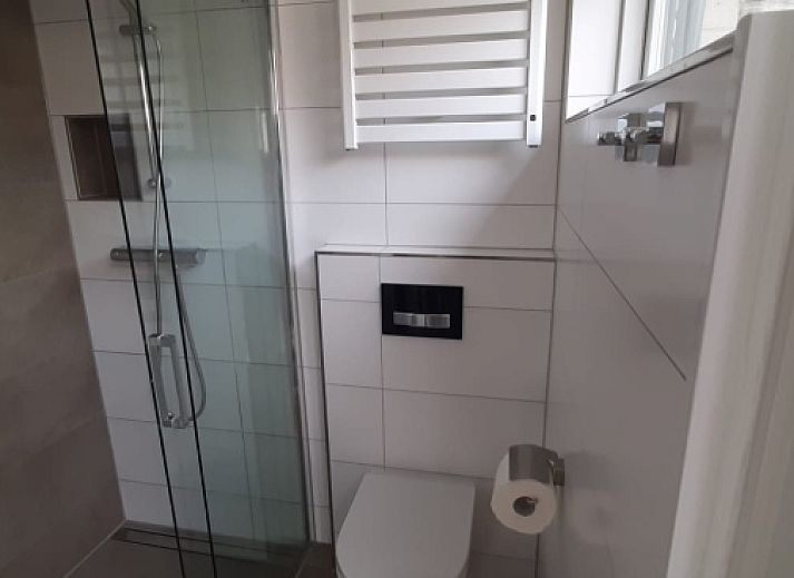 Spacious terrace at Apartment Duinzee Texel, De Koog, ideal for relaxing outside in the sun on the Wadden Islands.