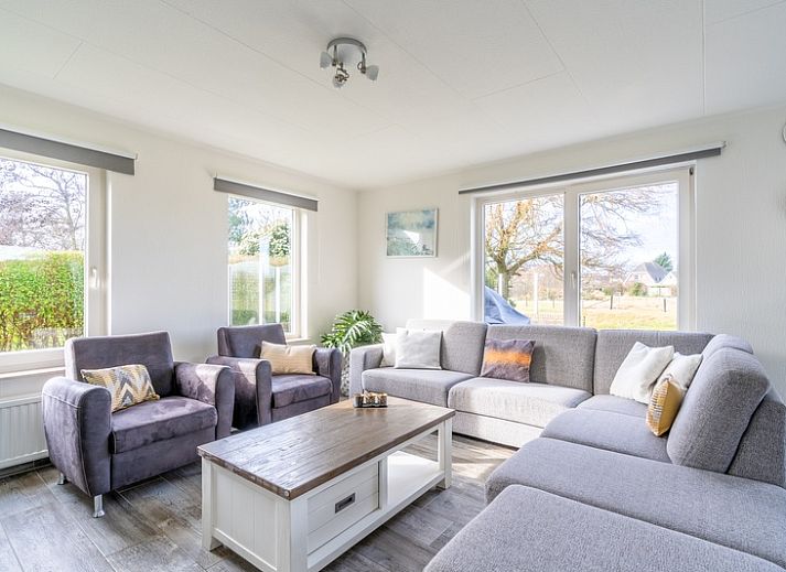 Vacation home Honeysuckle 67 in De Koog Texel with spacious garden and terrace on the water, ideal for relaxation on the Wadden Islands.