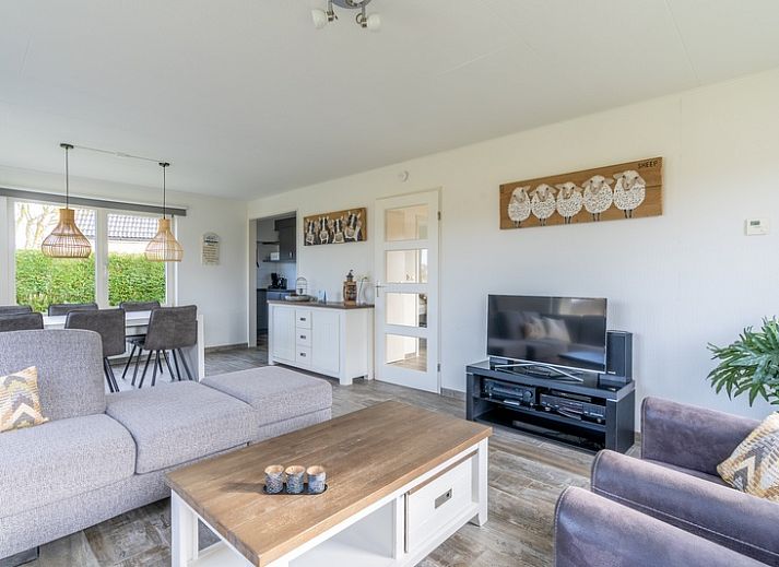 Cozy vacation home Honeysuckle 67 in De Koog Texel with beautiful views of green surroundings and waterfront on the Wadden Islands.