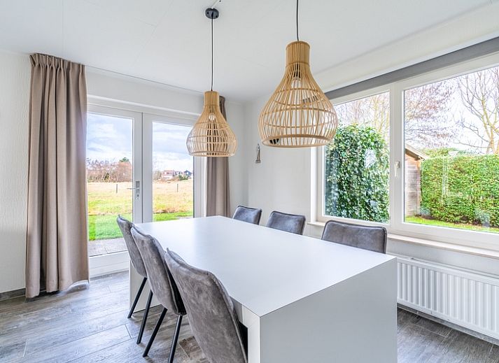 Cozy vacation home Honeysuckle 67 in De Koog Texel with beautiful views of green surroundings and waterfront on the Wadden Islands.