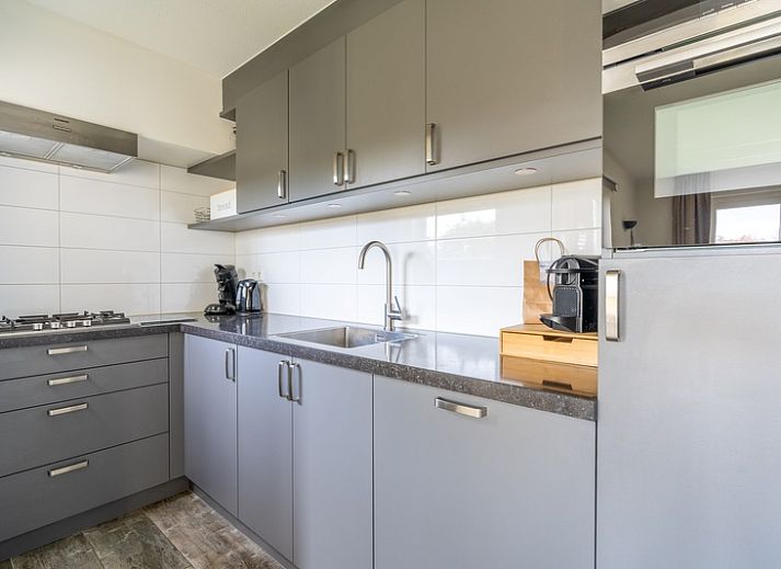 Cozy vacation home Honeysuckle 67 in De Koog Texel with beautiful views of green surroundings and waterfront on the Wadden Islands.