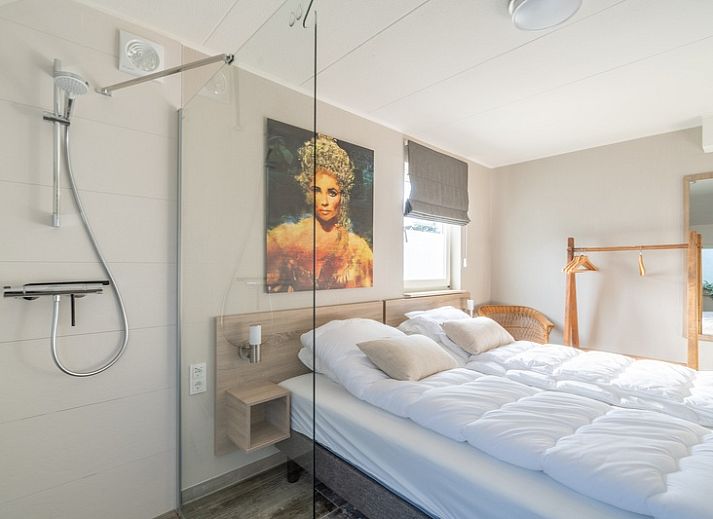 Cozy vacation home Honeysuckle 67 in De Koog Texel with beautiful views of green surroundings and waterfront on the Wadden Islands.