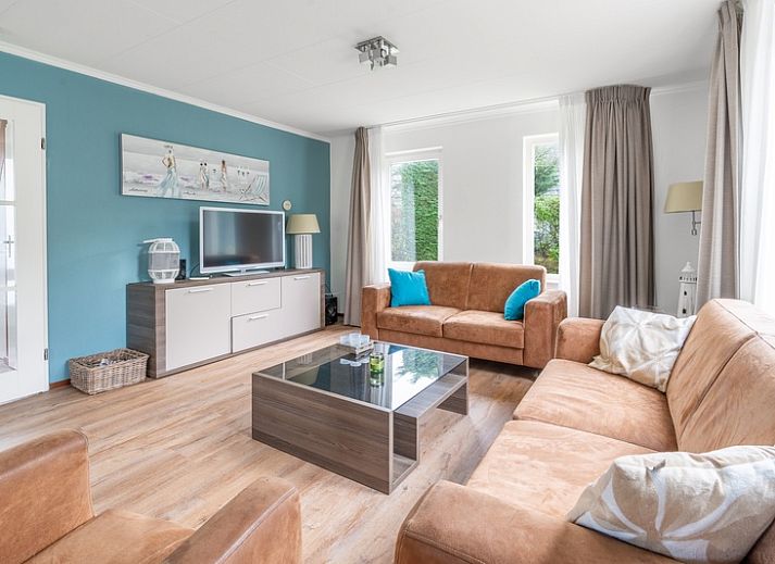 Cozy terrace at Holiday home Honeysuckle 49 in De Koog, Texel, ideal for relaxation on the Wadden Islands.