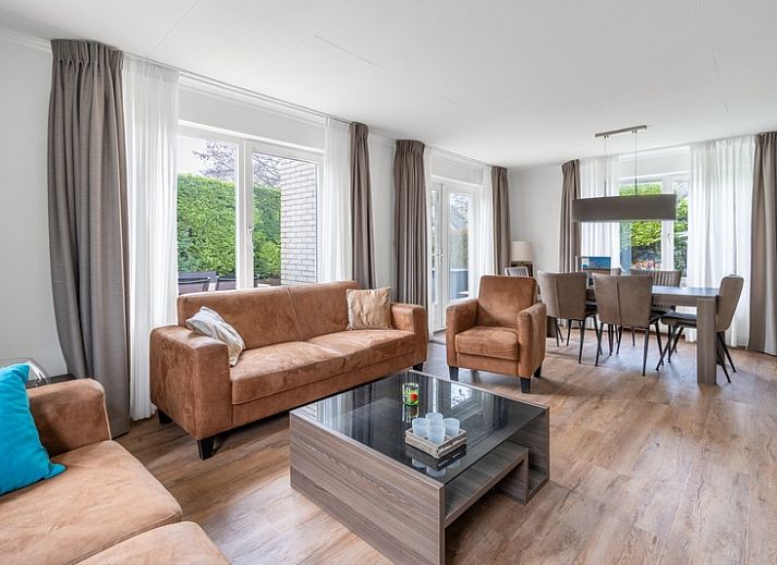 Cozy terrace at Holiday home Honeysuckle 49 in De Koog, Texel, ideal for relaxation on the Wadden Islands.