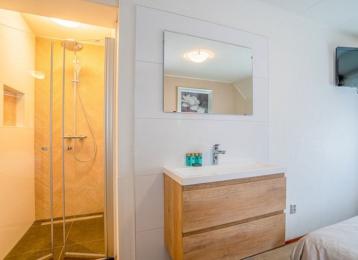 Exterior of Holiday home Honeysuckle 49 in De Koog with spacious garden, perfect for a Texel vacation.