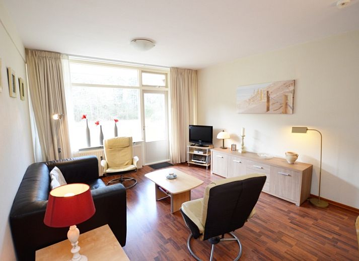 Cozy living room in Apartment Kerckeland 24, De Koog, Texel with modern furnishings and comfortable seating area.