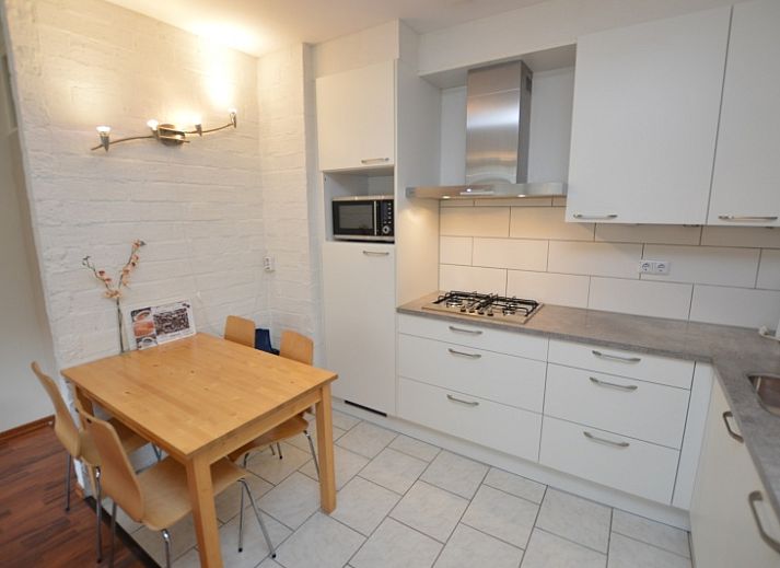 Cozy living room in Apartment Kerckeland 24, De Koog, Texel with modern furnishings and comfortable seating area.