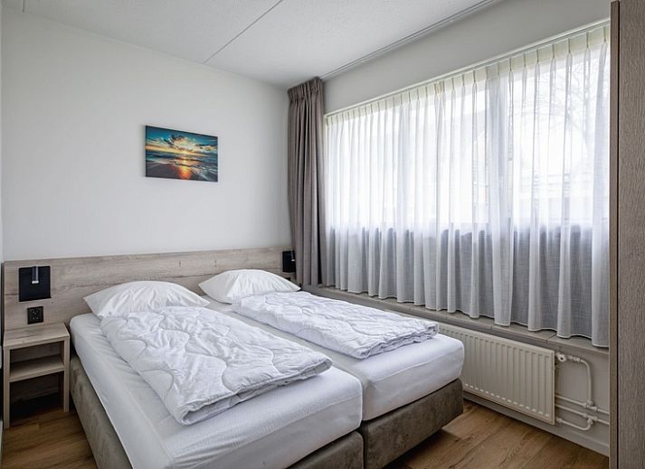 Spacious sitting area in Two persons apartment large - first floor, De Koog, Texel with comfortable sofa and armchair.