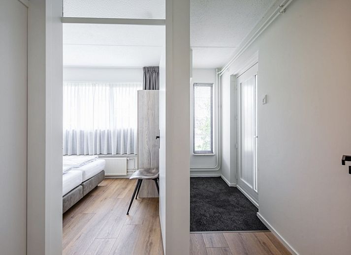 Spacious sitting area in Two persons apartment large - first floor, De Koog, Texel with comfortable sofa and armchair.