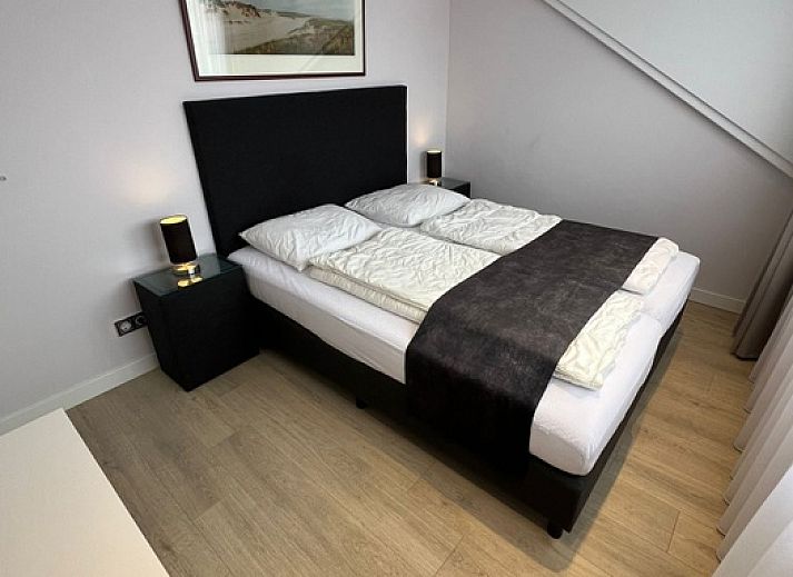 Stylish living room of Holiday home Duinzee Texel in De Koog with comfortable seating.