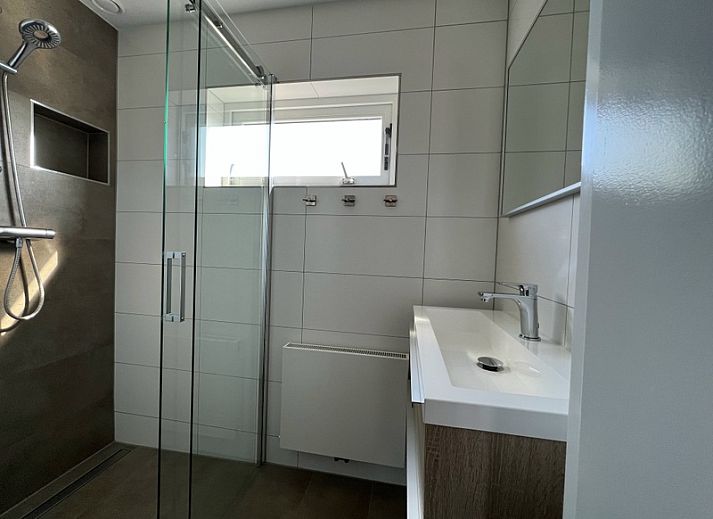 Stylish living room of Holiday home Duinzee Texel in De Koog with comfortable seating.