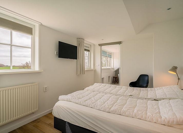 Gemuetliches Wohnzimmer mit Holzofen in Cottage in De Koog, Texel Ferienhaus, Watteninseln.