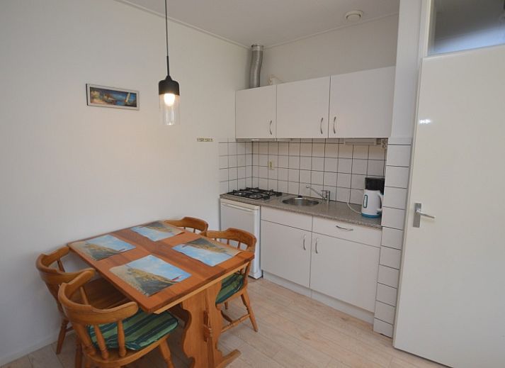 Bright living room with large windows in Apartment Kerckeland 80, De Koog, Texel, ideal for relaxation.