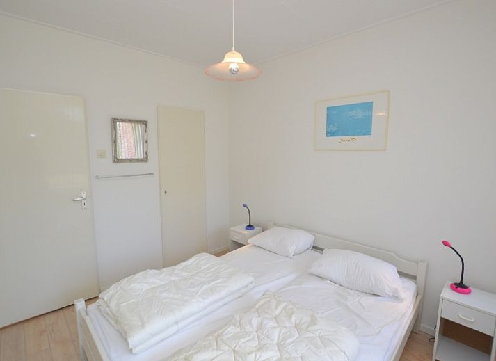 Bright living room with large windows in Apartment Kerckeland 80, De Koog, Texel, ideal for relaxation.