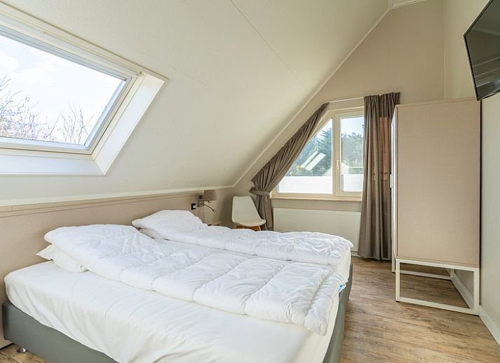 Cozy living room in Holiday Home Honeysuckle 57, De Koog, Texel with comfortable seating area and natural light.