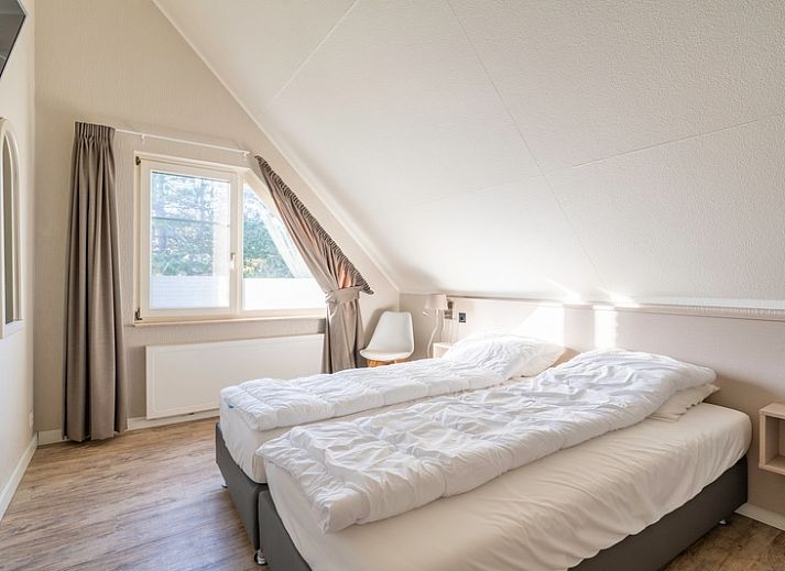 Cozy living room in Holiday Home Honeysuckle 57, De Koog, Texel with comfortable seating area and natural light.