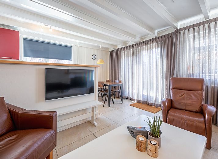 Spacious terrace at 32a Castor vacation home in De Koog, Texel, ideal for outdoor breakfasts.