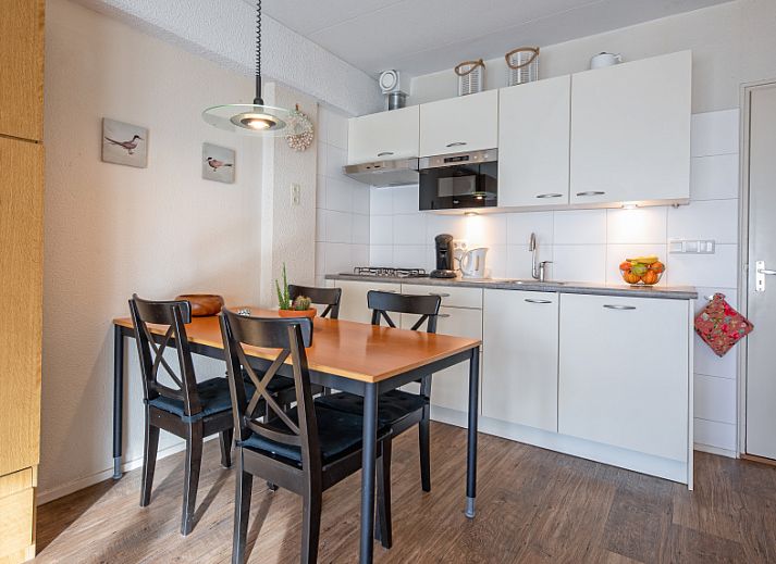 Cozy living room in Motel Texel Apartment with bath (B), De Koog, Texel with comfortable sofa and dining area.