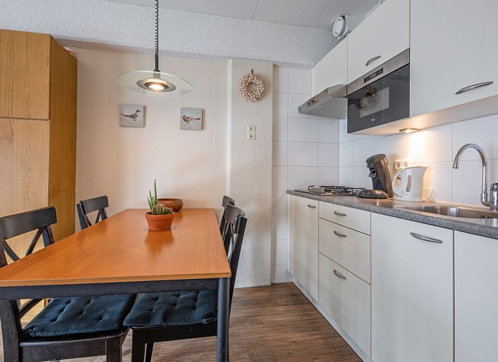 Cozy living room in Motel Texel Apartment with bath (B), De Koog, Texel with comfortable sofa and dining area.