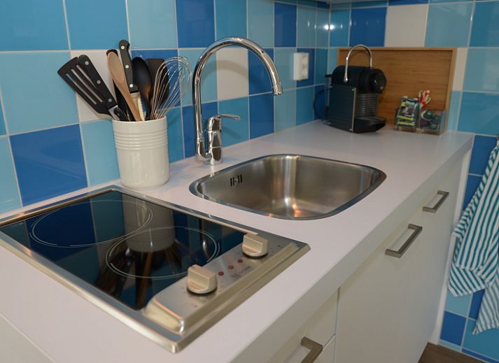 Exterior of Grand Hotel Opduin - Holiday Apartment B, De Koog, Texel with charming architecture and cycling guests.