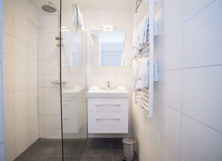 Exterior of Grand Hotel Opduin - Holiday Apartment B, De Koog, Texel with charming architecture and cycling guests.