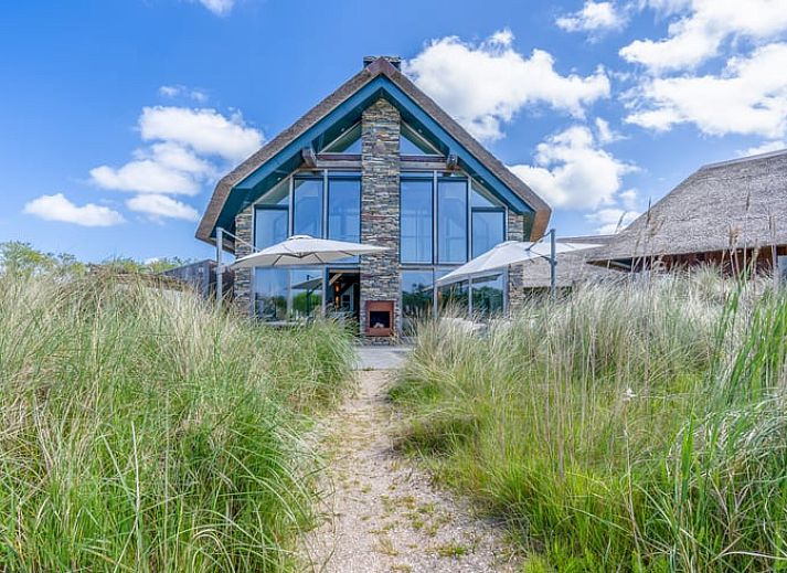 Thatched cottage in De Koog located in the nature of Texel, Wadden Islands.