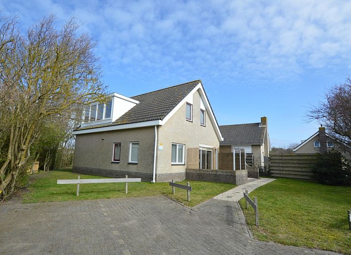 Vacation home Stappeland 205 in De Koog, Texel offers a charming exterior with an inviting terrace and green surroundings.