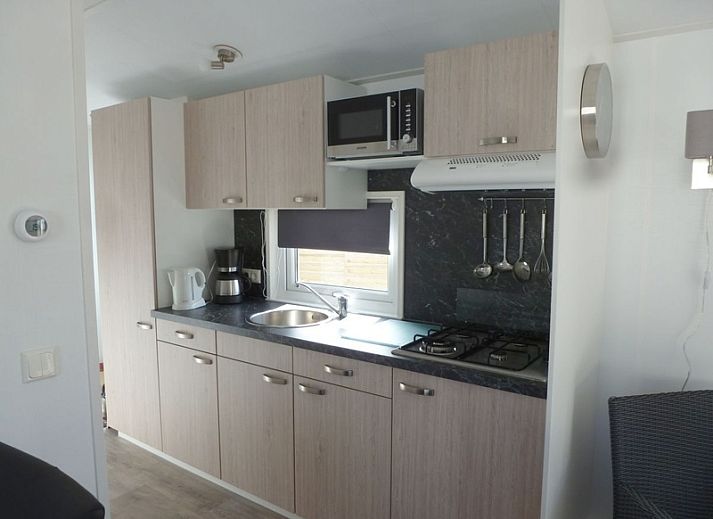 Chalet Bregkoog 47 'De Muy' on Texel. Vacation home with sunny terrace in De Koog, ideal for relaxation.