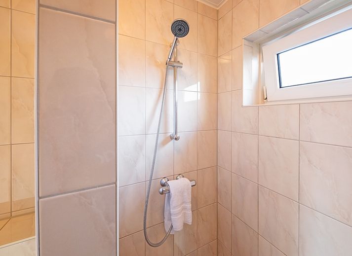 Cozy garden with terrace at De Strandvondst vacation home in De Koog, Texel.