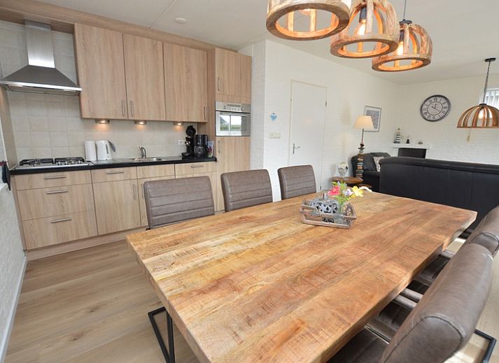 Cozy living room in Holiday home Stappeland 205, De Koog, Texel with comfortable seating area and access to the garden.