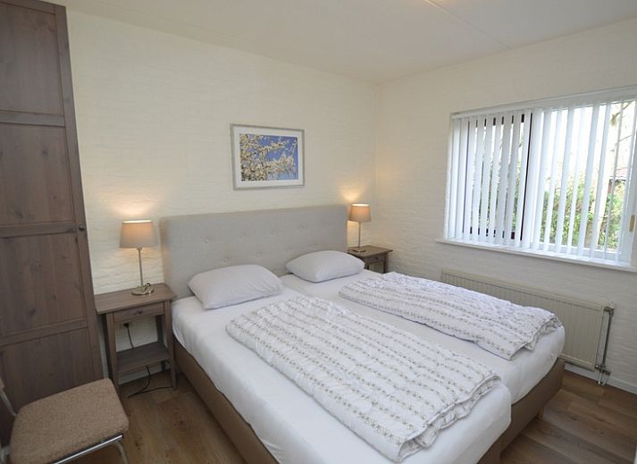 Cozy living room in Holiday home Stappeland 205, De Koog, Texel with comfortable seating area and access to the garden.