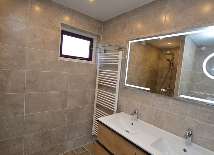 Stylish interior of Holiday home Stappeland 205 in De Koog, Texel with modern furniture and lots of natural light.