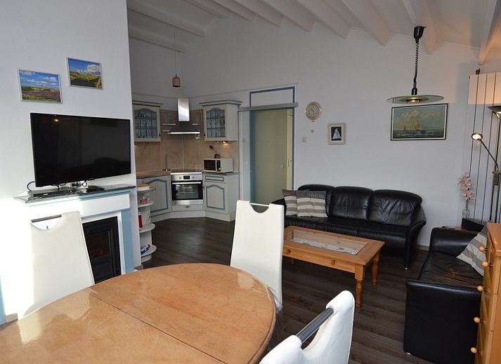 Spacious indoor area of Motel Texel - Apartment 315/1T, De Koog, Texel with dining area and terrace view.