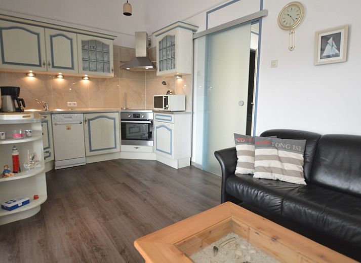 Spacious indoor area of Motel Texel - Apartment 315/1T, De Koog, Texel with dining area and terrace view.