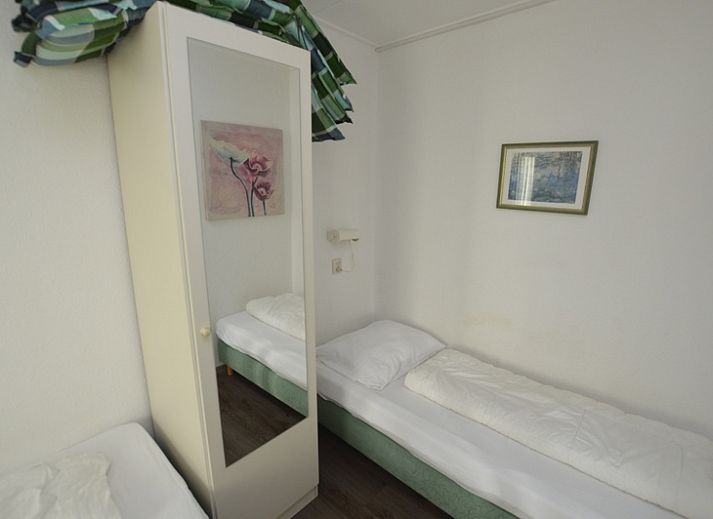 Spacious indoor area of Motel Texel - Apartment 315/1T, De Koog, Texel with dining area and terrace view.