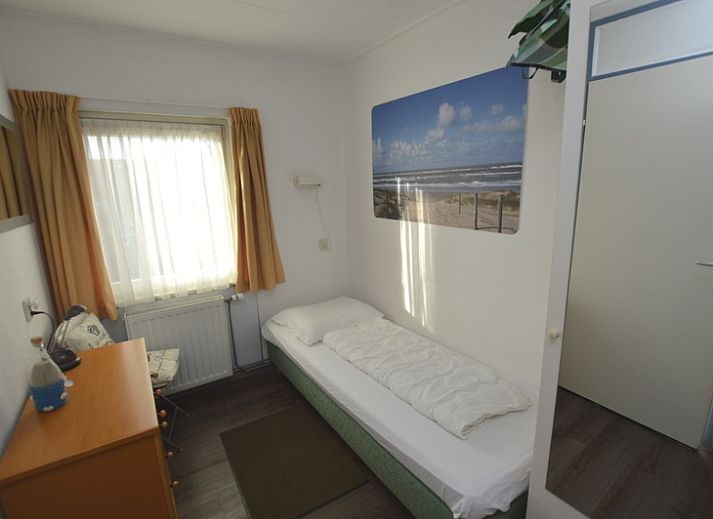 Spacious indoor area of Motel Texel - Apartment 315/1T, De Koog, Texel with dining area and terrace view.