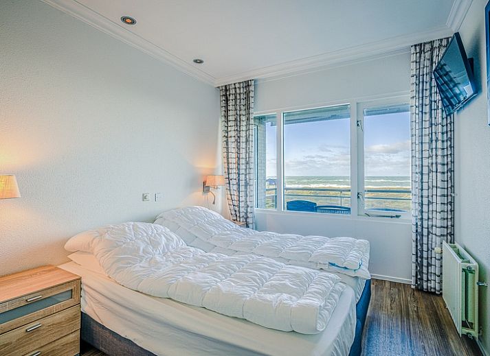 Comfortabele zithoek met uitzicht op de kust in Appartement Juliana 164 Zeezicht, Texel.